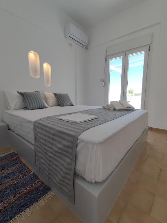 Postel nebo postele na pokoji v ubytování Agnanti Hotel