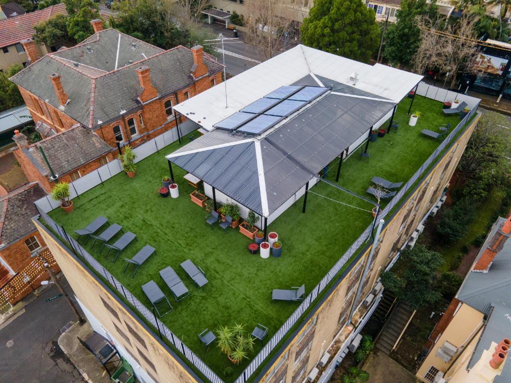 an overhead view of a building with a large roof at The Village Glebe in Sydney