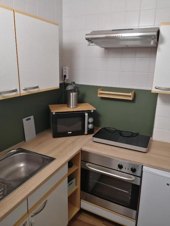 Kuchyň nebo kuchyňský kout v ubytování Pension Arkadenhof