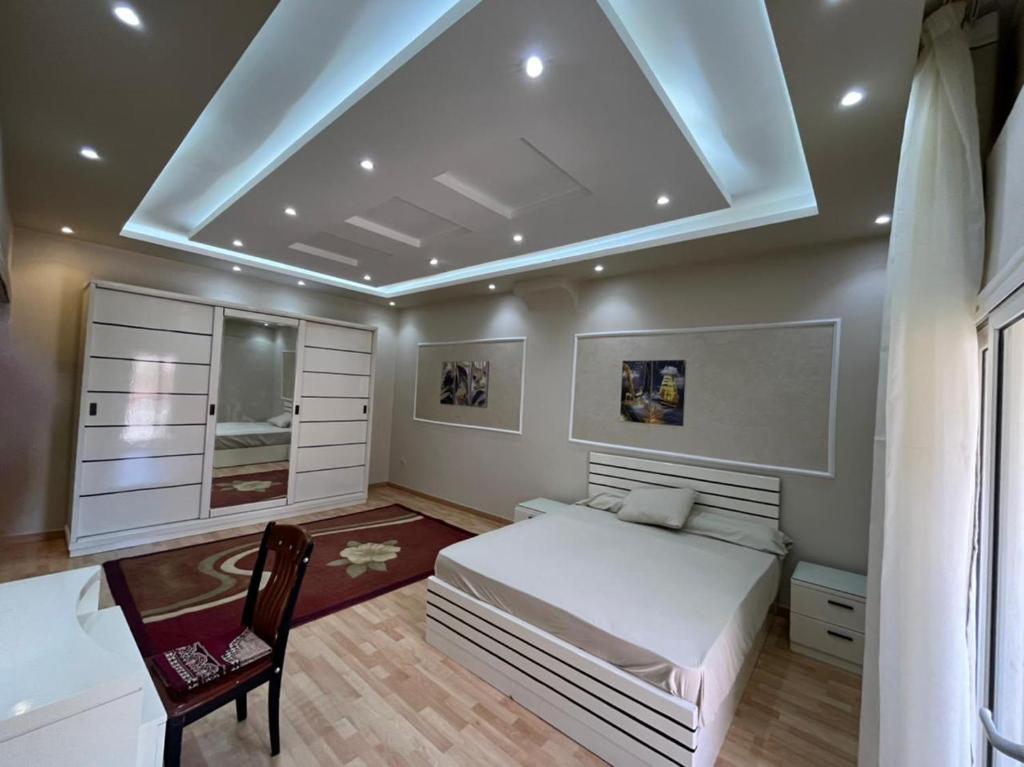 A bed or beds in a room at The best location in garden city
