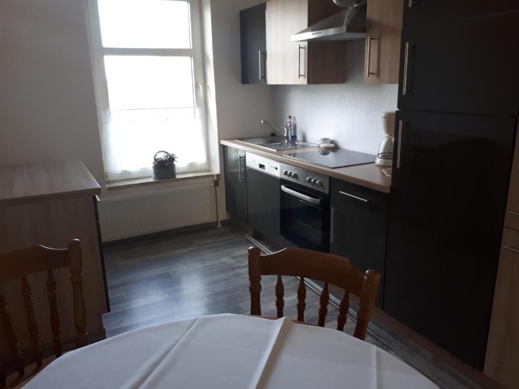 Kuchyň nebo kuchyňský kout v ubytování Ferienwohnung Wassermühlenholz Kappeln