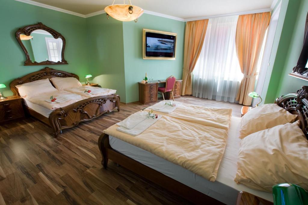 Postel nebo postele na pokoji v ubytování Hotel Bow Garden