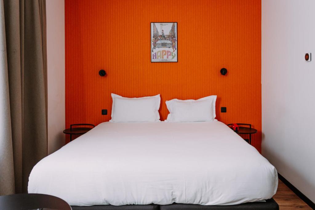Postel nebo postele na pokoji v ubytování ClapClap Hôtel, Food & Bar