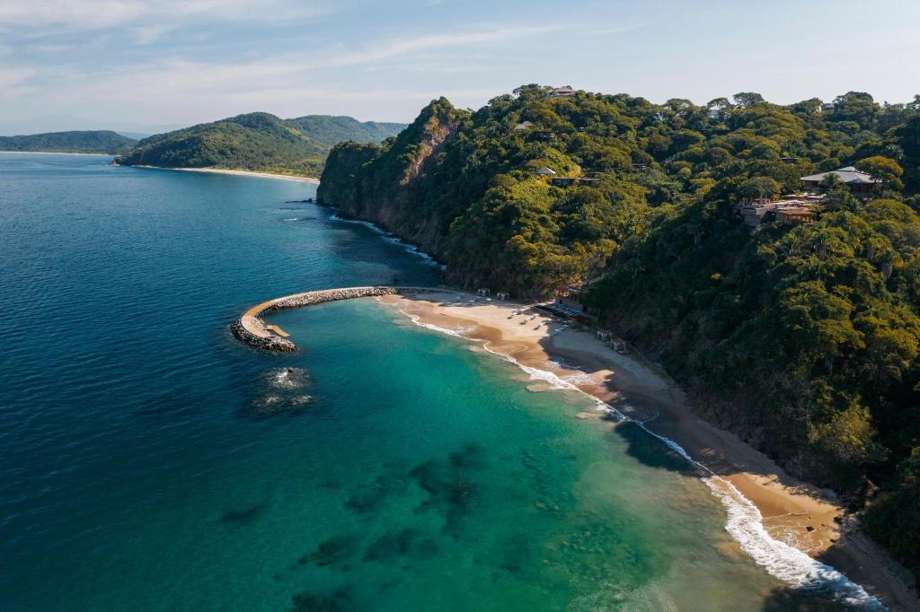 an aerial view of a beach in the ocean at One&Only Mandarina in Lo de Marcos
