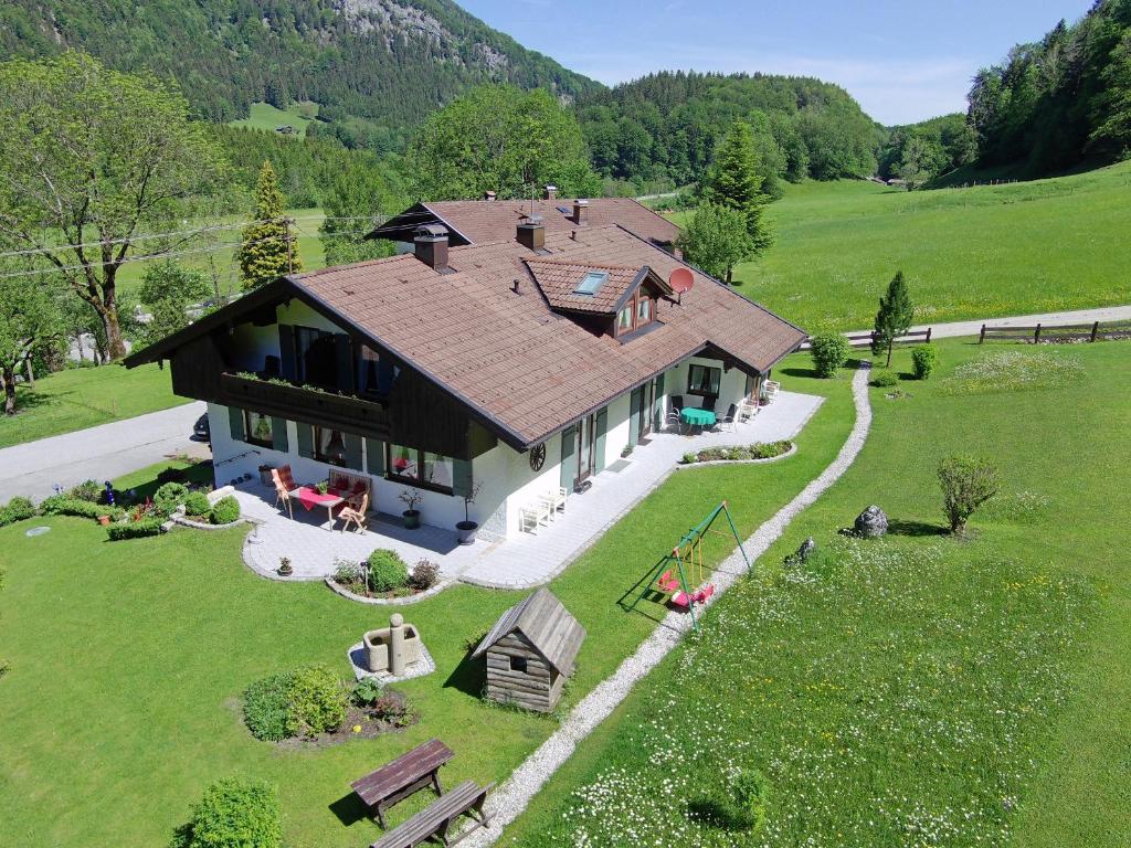 an aerial view of a house in a field at Gästehaus Fellner in Aschau im Chiemgau