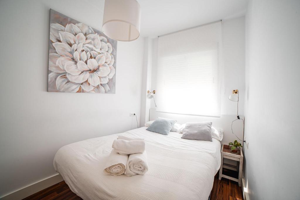 Posteľ alebo postele v izbe v ubytovaní Apartamento La Tana centro