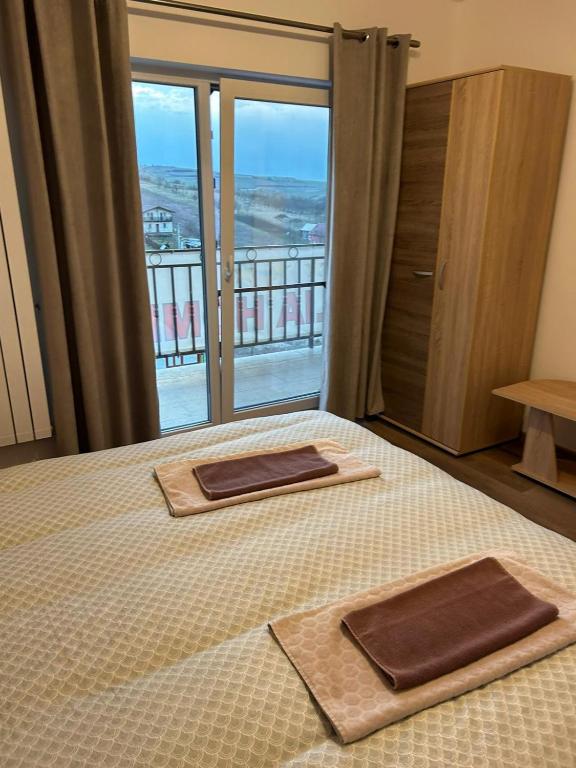Postel nebo postele na pokoji v ubytování Pensiunea Giulia Home