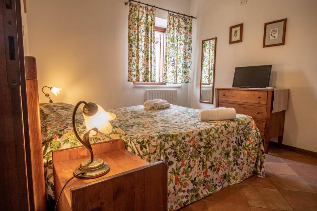 Postel nebo postele na pokoji v ubytování Antico Borghetto - Casa Vacanze