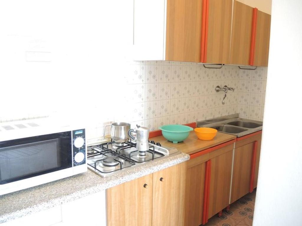 A kitchen or kitchenette at Nice apartment with balcony and beautiful view - By Beahost Rentals