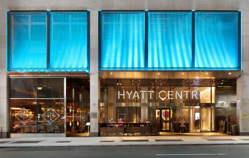 a store front of a shopping center with blue windows at Hyatt Centric Times Square New York in New York