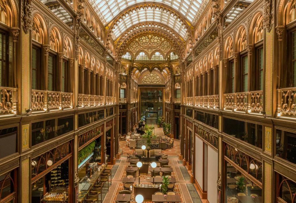 an image of a large building with a glass ceiling at Párisi Udvar Hotel Budapest, part of Hyatt in Budapest