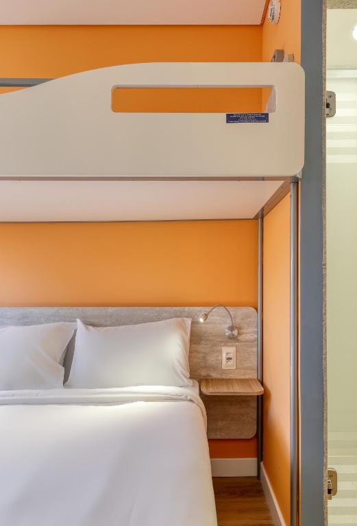 Postel nebo postele na pokoji v ubytování ibis budget BH Savassi