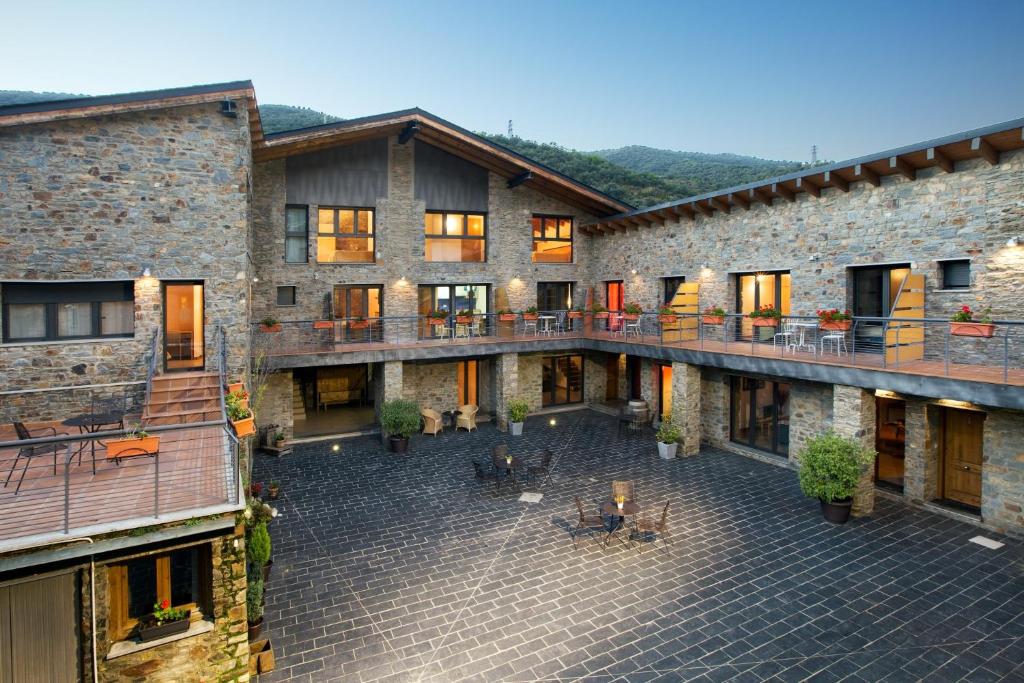 an aerial view of a building with a patio at Allotjament Rural Cal Miquel in Anserall