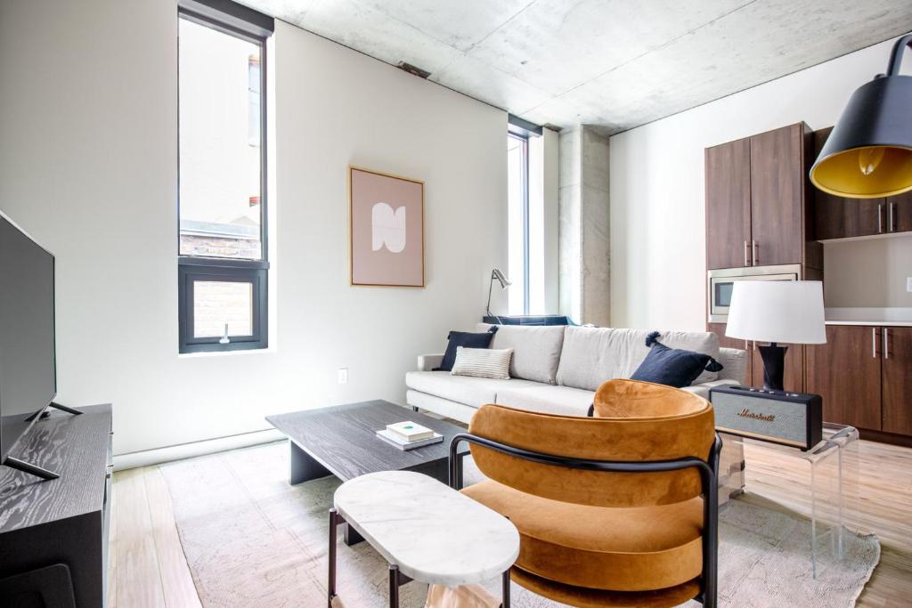 a living room with a couch and a table at Downtown 1BR w Gym WD walkable location SEA-48 in Seattle