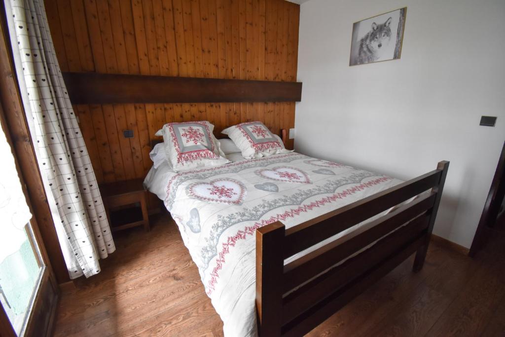 Postel nebo postele na pokoji v ubytování Hôtel Le Chinfrey