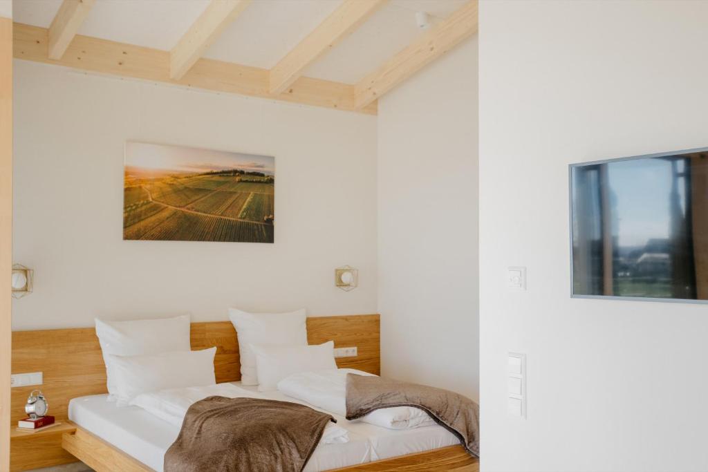 Postel nebo postele na pokoji v ubytování Weinberg Chalets