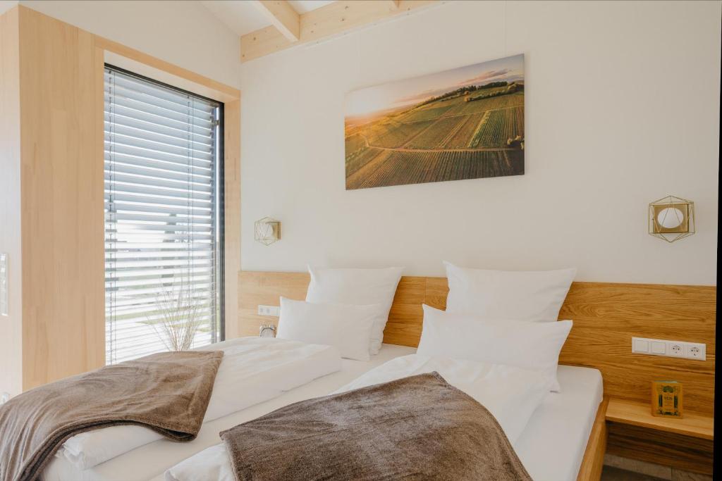 Postel nebo postele na pokoji v ubytování Weinberg Chalets