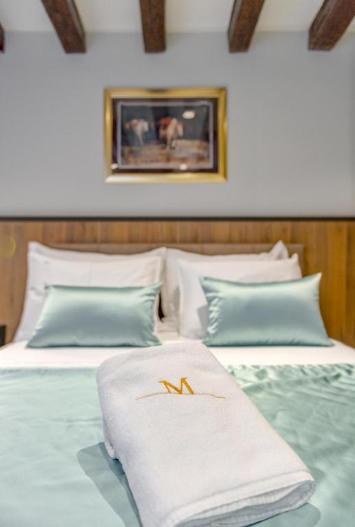 Posteľ alebo postele v izbe v ubytovaní Makarun Heritage Rooms