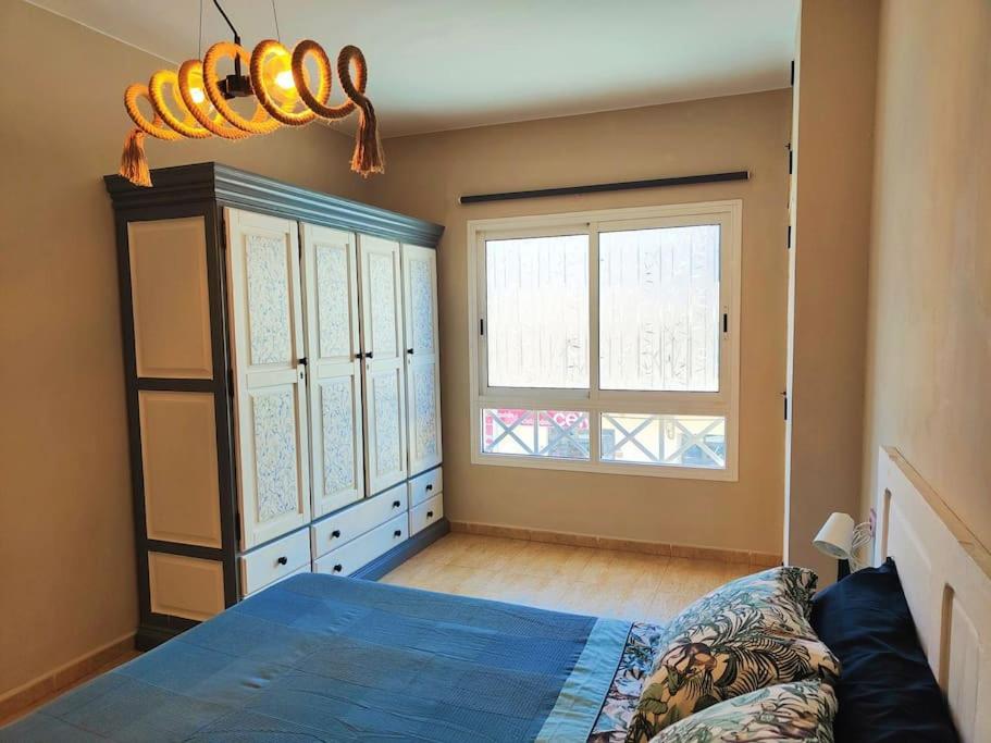 מיטה או מיטות בחדר ב-Casa Burbuja Azul