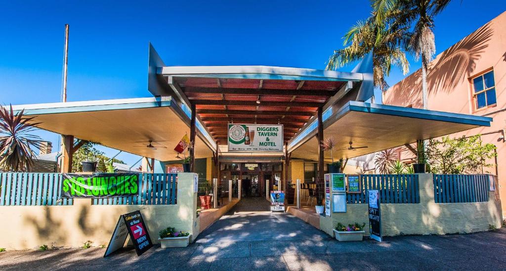 a building with awning in front of a street at Diggers Tavern in Bellingen