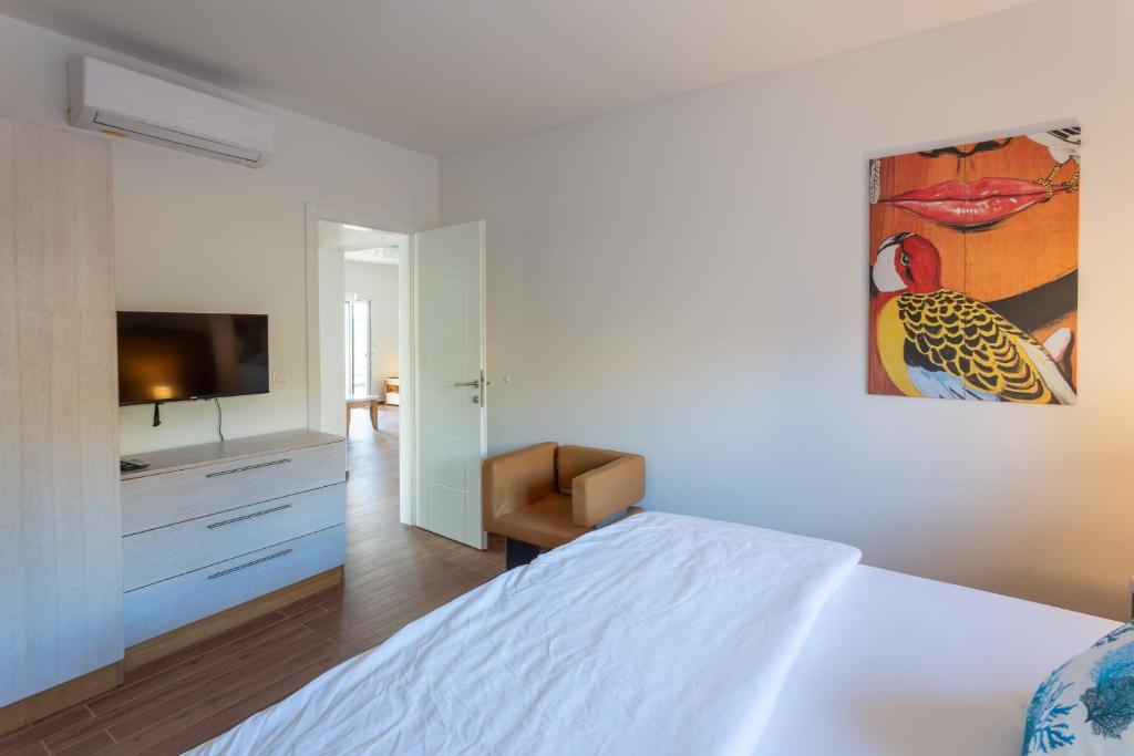 Postel nebo postele na pokoji v ubytování Rtina Appartements