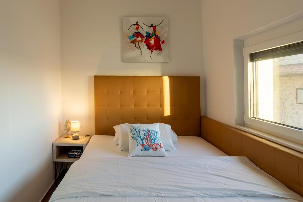 Postel nebo postele na pokoji v ubytování Rtina Appartements