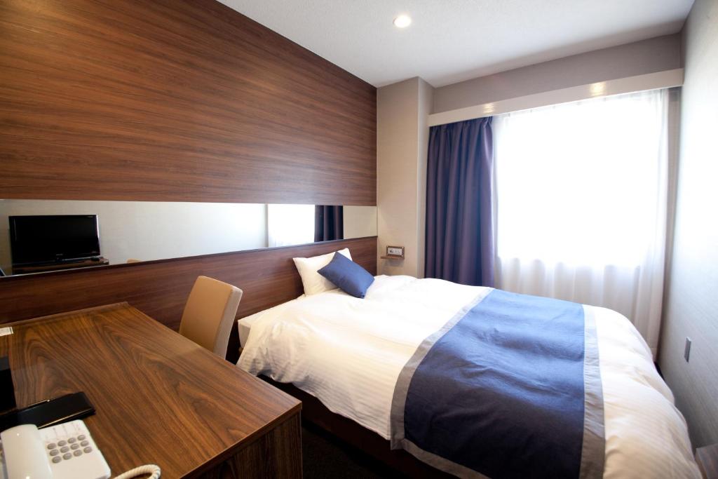 Ліжко або ліжка в номері Hotel Il Credo Gifu