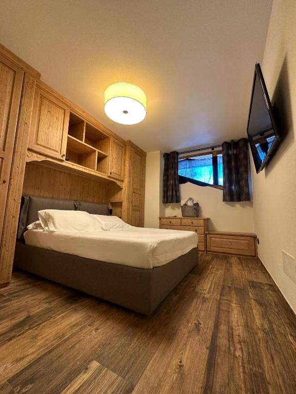 Łóżko lub łóżka w pokoju w obiekcie Hotel Relais Des Glaciers - Adults Only