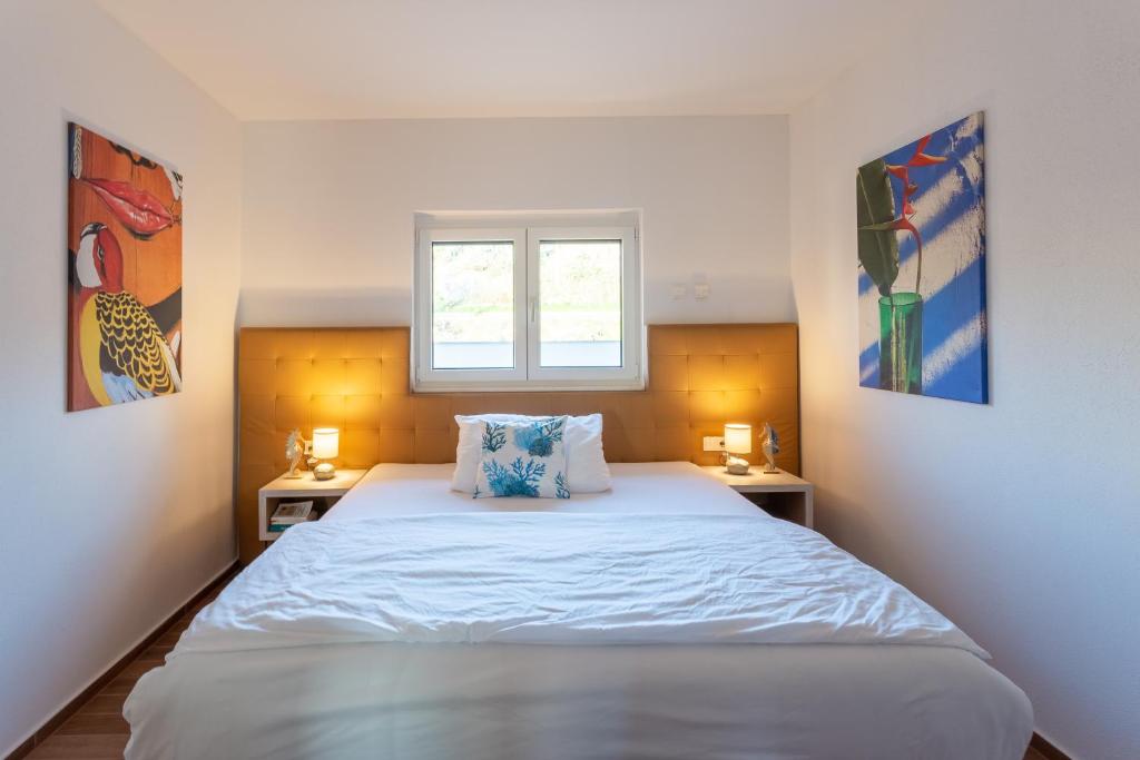 Postel nebo postele na pokoji v ubytování Rtina Appartements