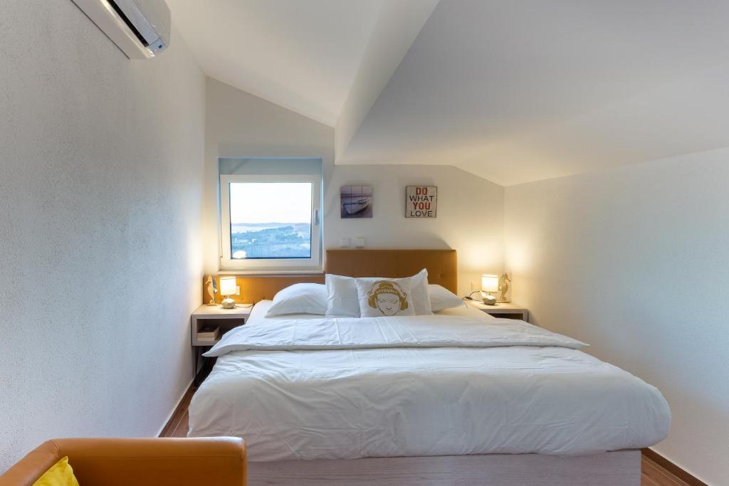 Postel nebo postele na pokoji v ubytování Rtina Appartements