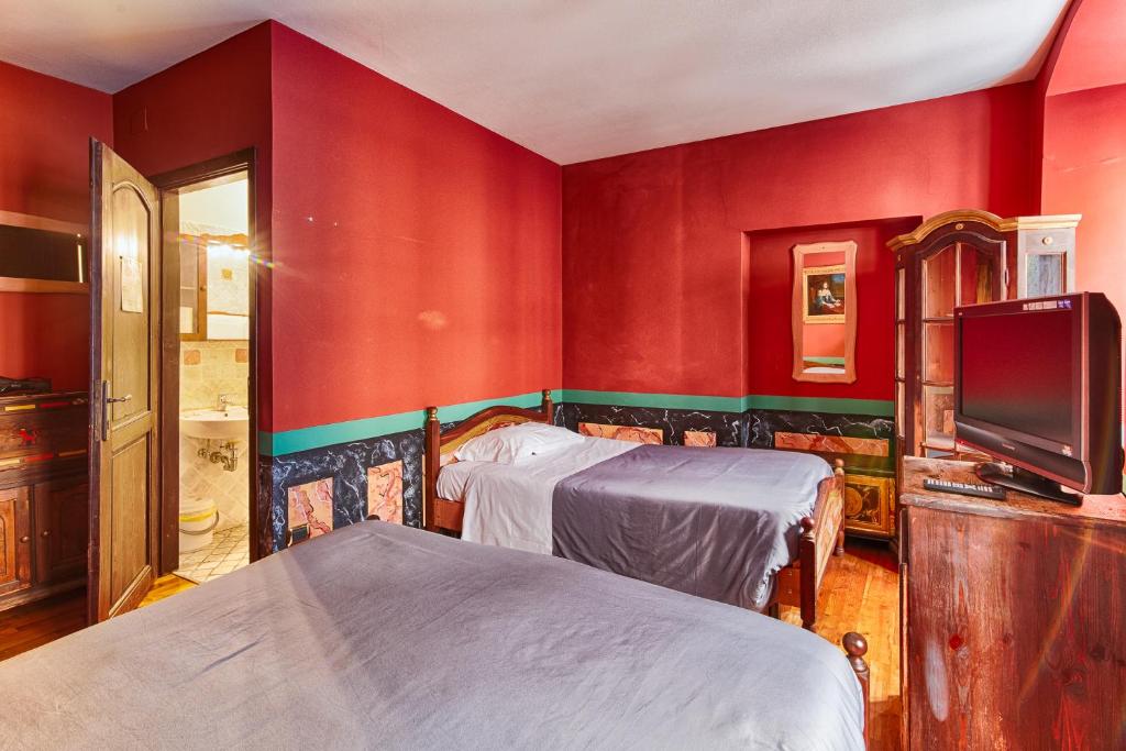 Postel nebo postele na pokoji v ubytování Hotel Portacavana