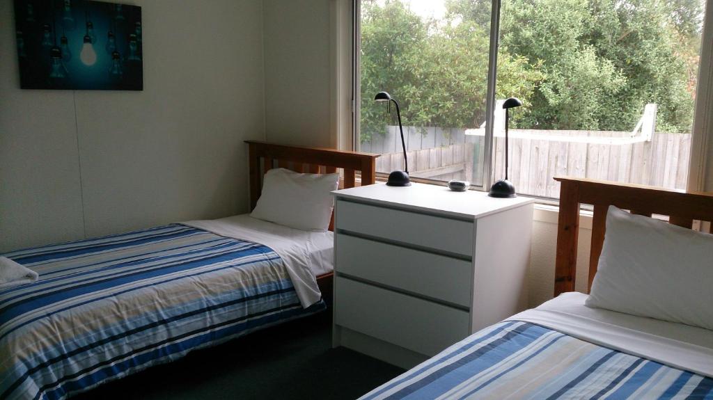 Letto o letti in una camera di Phillip Island Cottages