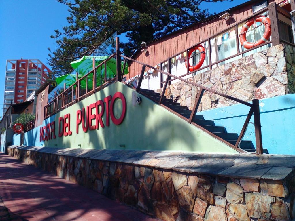 a set of stairs with a sign that reads ana pueblo at Hostel del Puerto in Punta del Este