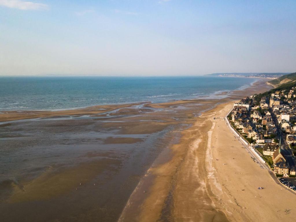 an aerial view of a beach with houses and the ocean at Apartment Le Chalet by Interhome in Cabourg