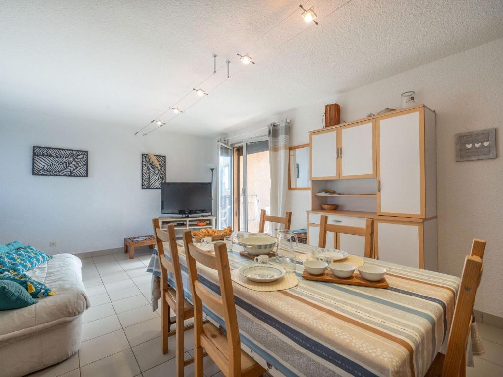 a kitchen and dining room with a table and chairs at Apartment Les Maisons de l'Océan-9 by Interhome in Lacanau-Océan