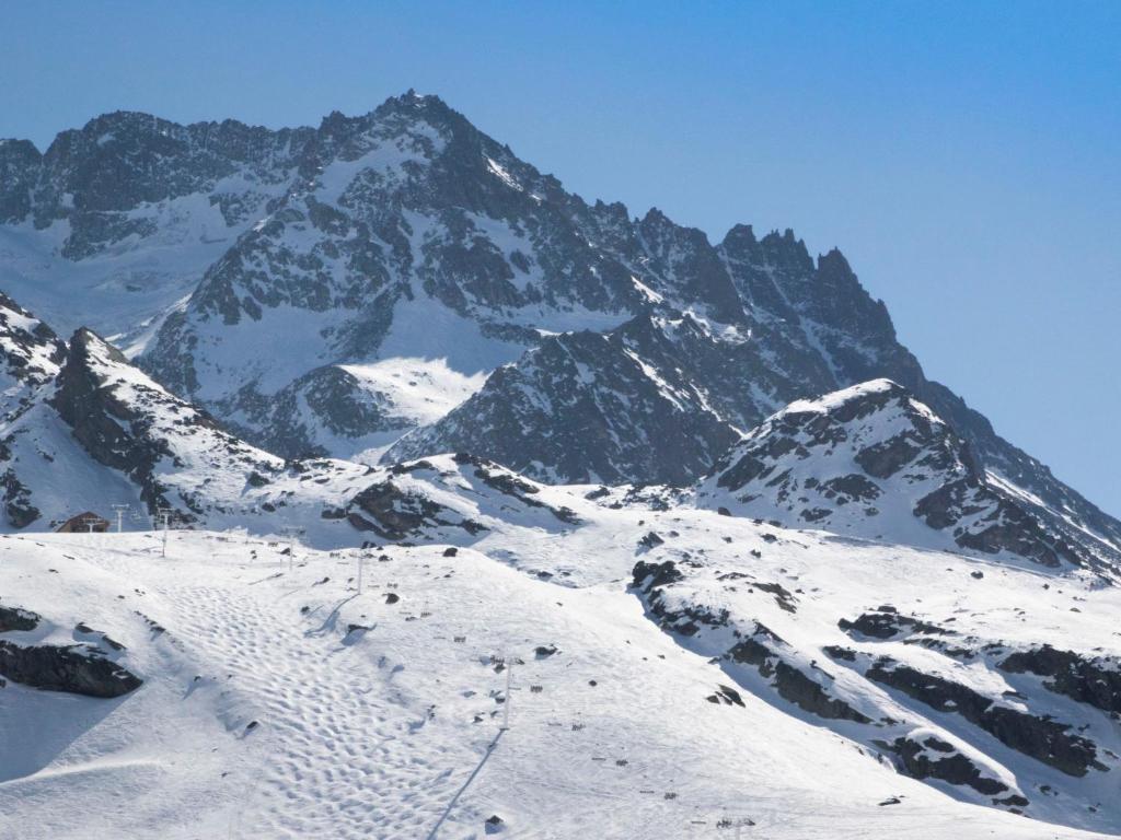 a snow covered mountain with a snow covered mountain at Apartment Les Glaciers by Interhome in Val Thorens