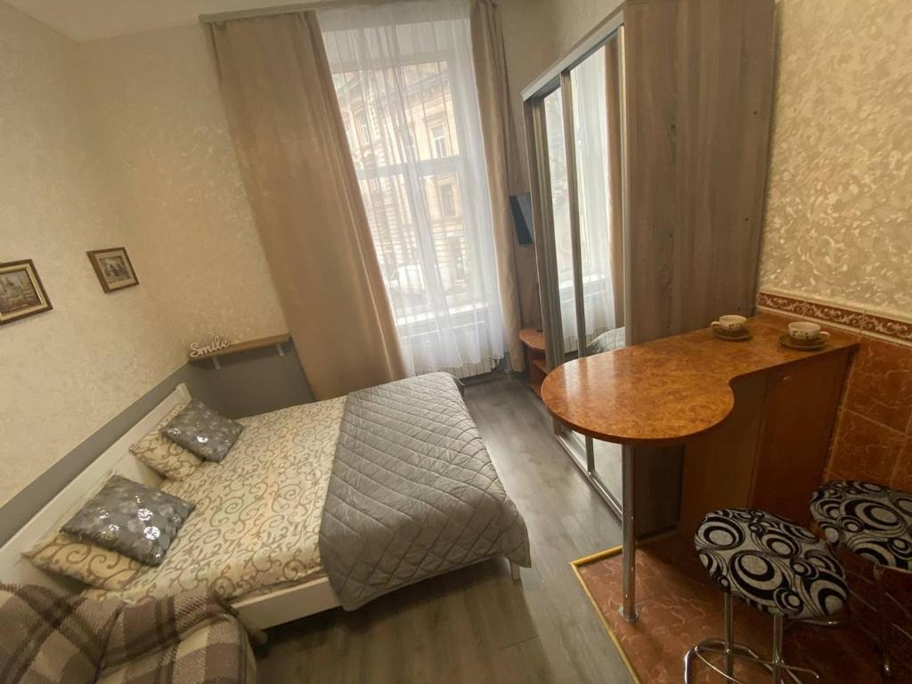 Кровать или кровати в номере Квартира на проспекті Шевченка