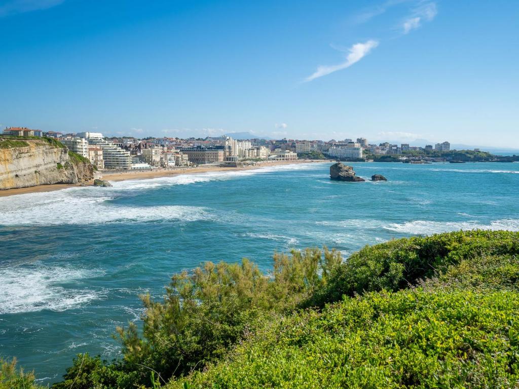 a view of the ocean with a beach and buildings at Apartment Carlton-1 by Interhome in Biarritz