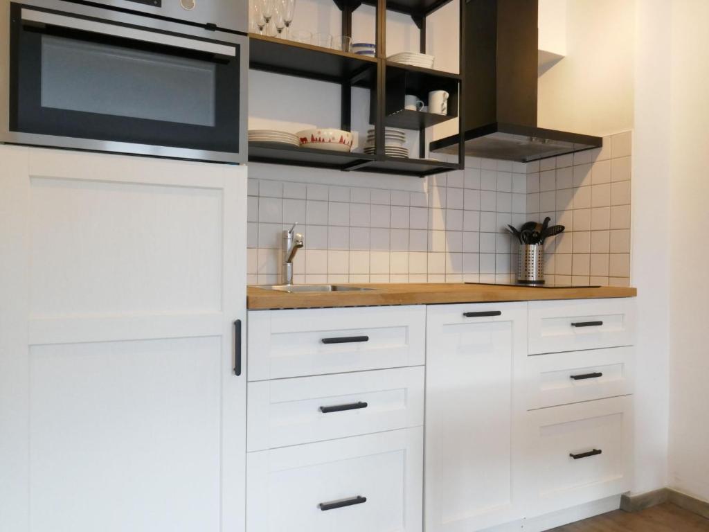 Kuchyň nebo kuchyňský kout v ubytování Apartment Galaxie 110 by Interhome