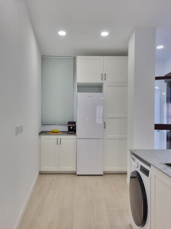 A kitchen or kitchenette at Residencial de la Yedra