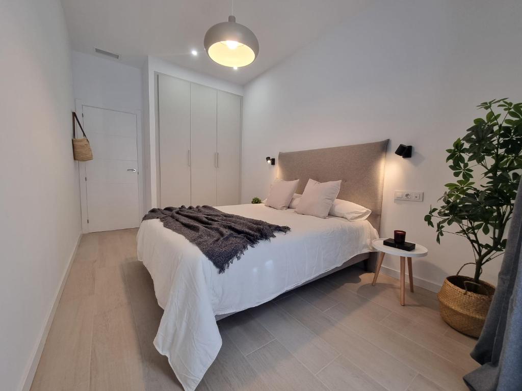 A bed or beds in a room at Residencial de la Yedra