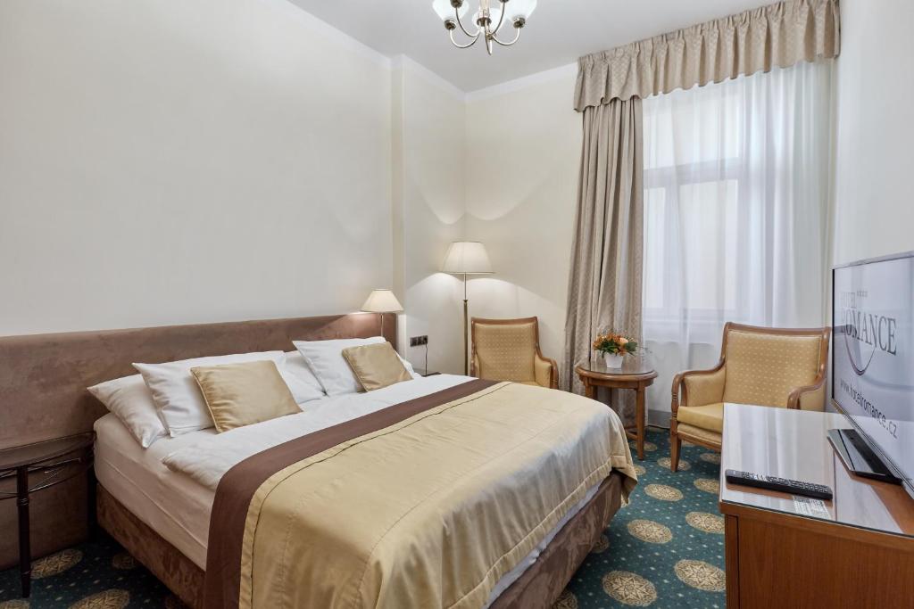 Voodi või voodid majutusasutuse Hotel Romance toas