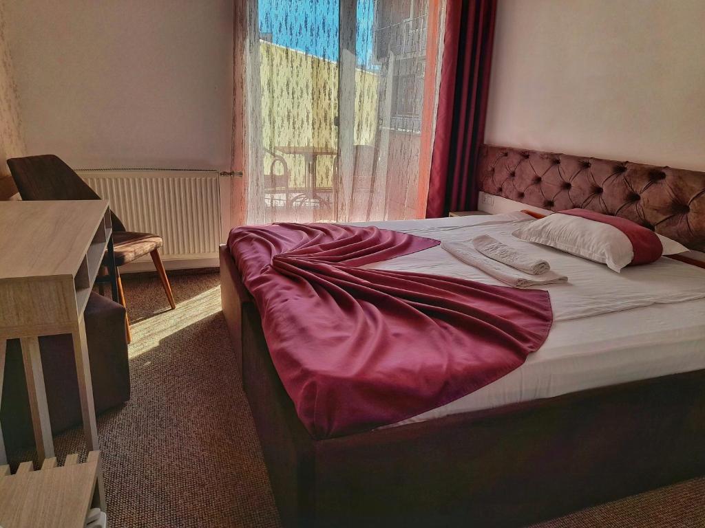 Postel nebo postele na pokoji v ubytování Hotel Alexis
