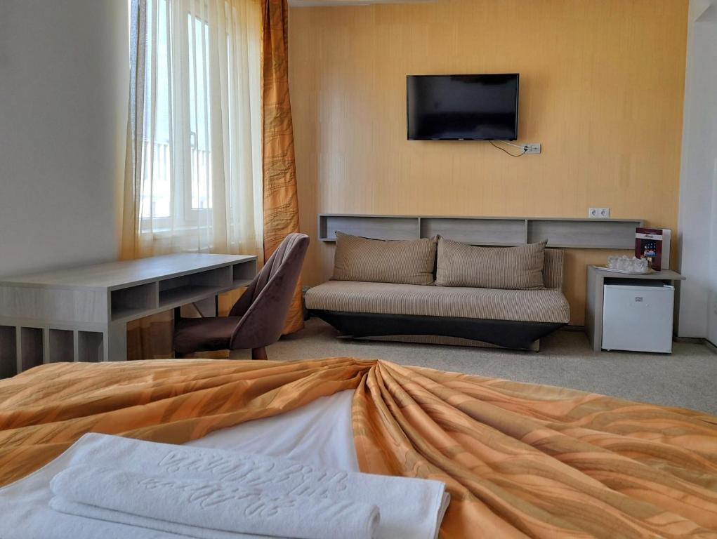 Postel nebo postele na pokoji v ubytování Hotel Alexis