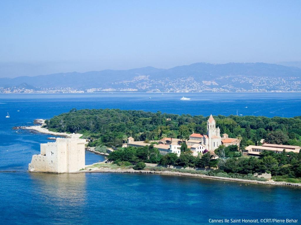 an island with a castle in the water at Apartment Les Pins D&#39;Alep by Interhome in Le Cannet