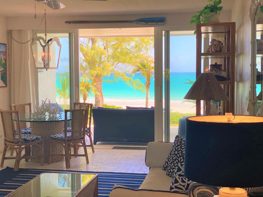 a living room with a view of the ocean at Treasured villa in Savannah Sound