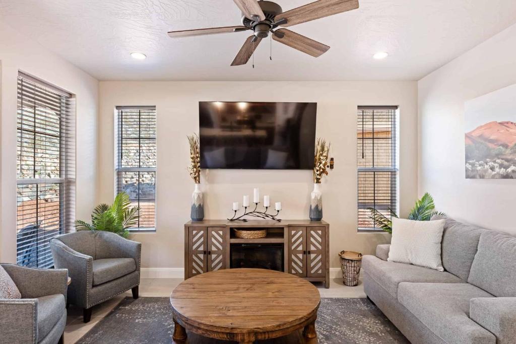 a living room with a couch and a tv at Escondido Cove in Washington