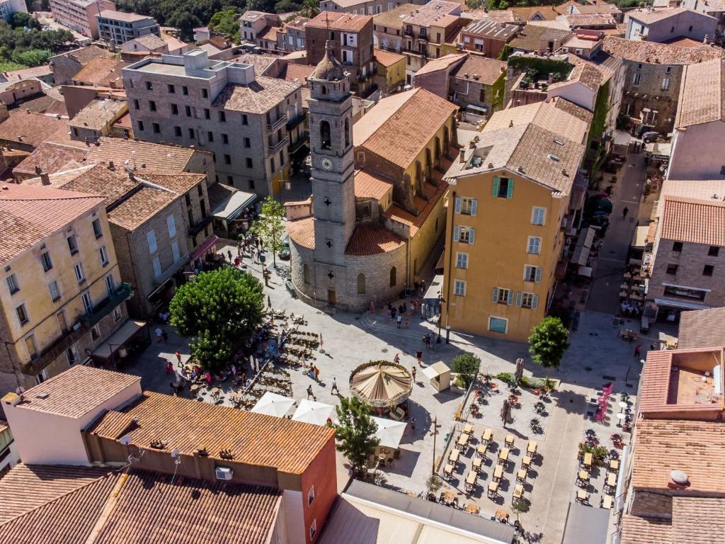 an aerial view of a city with a clock tower at Apartment Stanatura-4 by Interhome in Porto-Vecchio