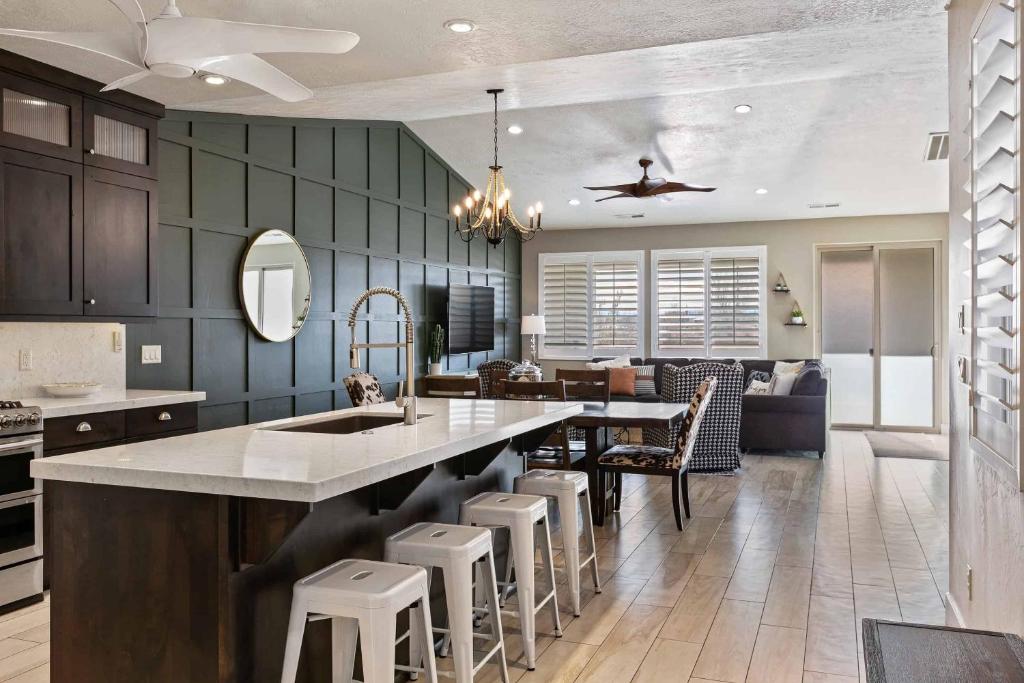 a kitchen with a large island with bar stools at Desert Moose #75 townhouse in Santa Clara