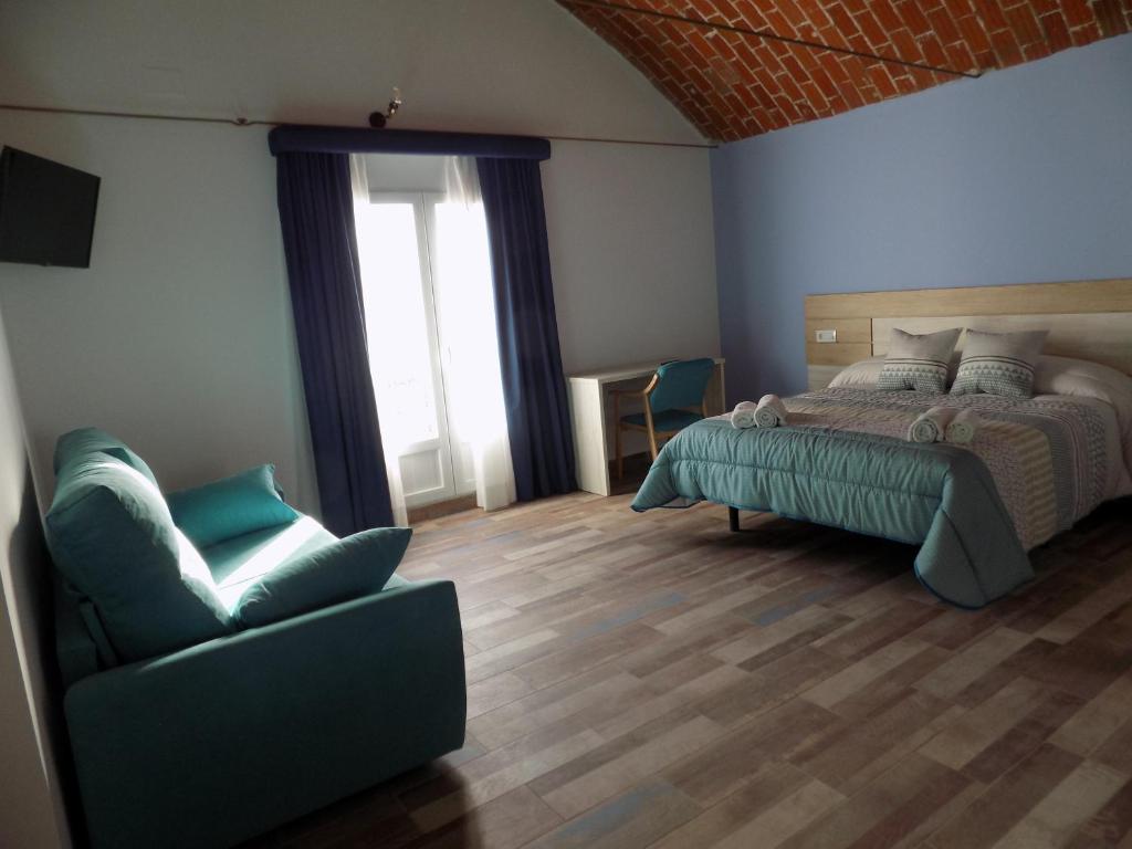Postel nebo postele na pokoji v ubytování Hotel Rural SUEÑOS DEL QUIJOTE